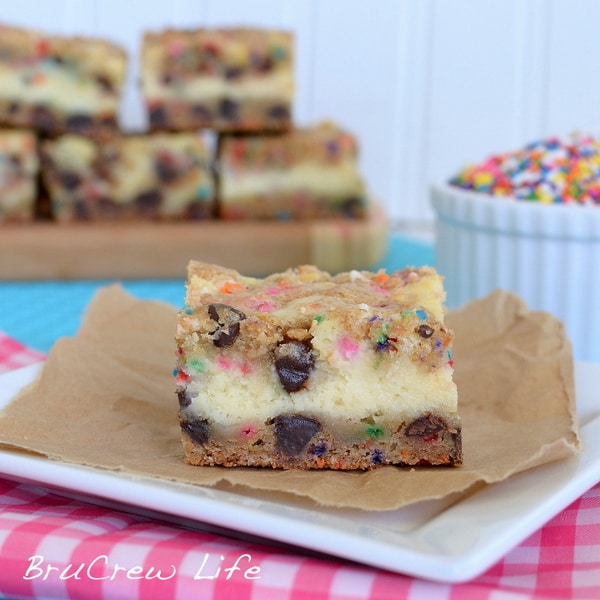 Key Lime Cheesecake Cookie Bars | Inside BruCrew Life - chocolate chip cookie bars with a key lime cheesecake center #cheesecake #cookies Key Lime Cheesecake Cookie Bars, key lime cheesecake, funfetti cookies
