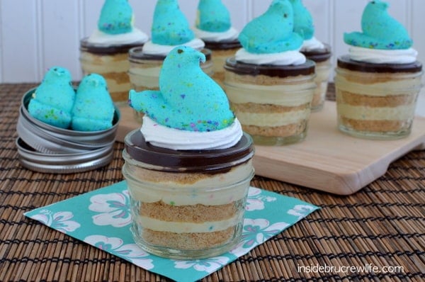 Party Peeps Eclair Cake Cups - cake batter pudding layered with graham crackers and chocolate frosting #CoolWhip #Peeps Party_Peeps_Eclair_Cake_Cups, Eclair Cake, Cool Whip, Peeps