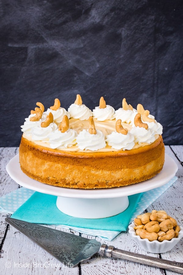 Caramel Cashew Cheesecake - the cashew crust and three times the caramel makes this full sized cheesecake an impressive dessert. Try this recipe for events and parties! #cheesecake #caramel #homemadewhippedcream #recipe #cashews