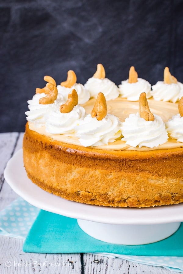 Caramel Cashew Cheesecake - three times the caramel makes this homemade cheesecake an impressive dessert. Perfect recipe for parties and events! #cheesecake #caramel #homemadewhippedcream #recipe #cashews