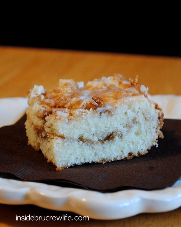A square of coffee cake on a white plate.