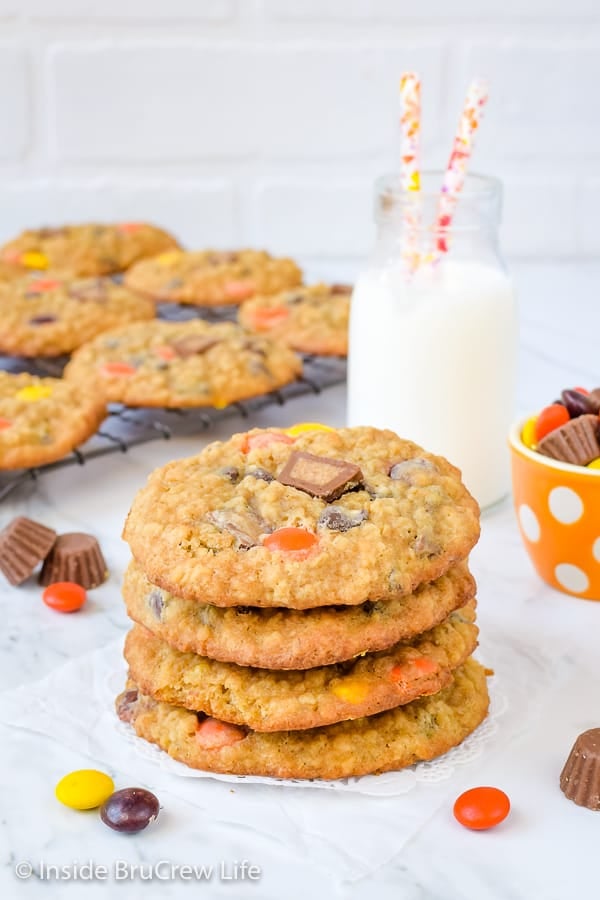 A stack of peanut butter oatmeal banana cookies with more cookies behind it