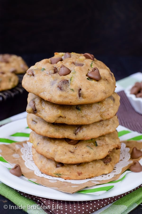 A stack of 5 banana zucchini cookies with chocolate chips on a white plate.