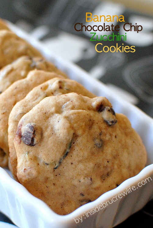 A stack of banana zucchini cookies in a white container.