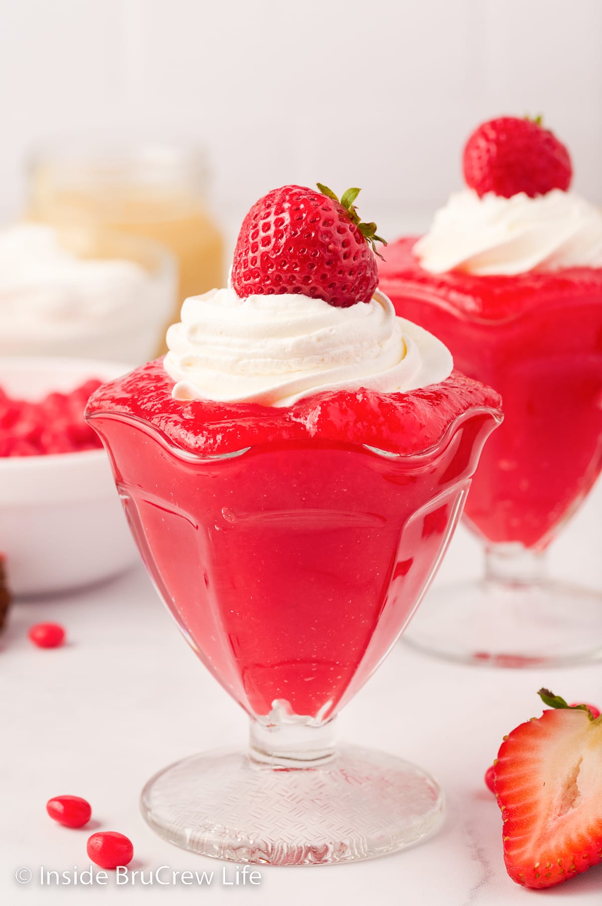 Two clear dishes filled with red hot Jello.