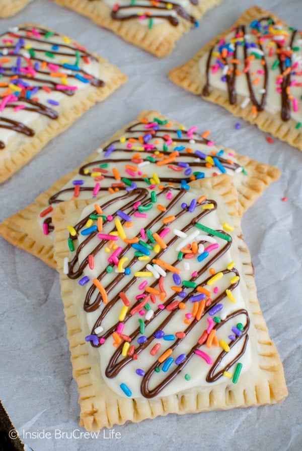 Close up picture of two stacked Nutella pop tarts topped with chocolate and sprinkles