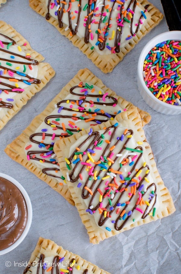 Overhead picture of two stacked pop tarts topped with white chocolate, chocolate drizzles, and sprinkles