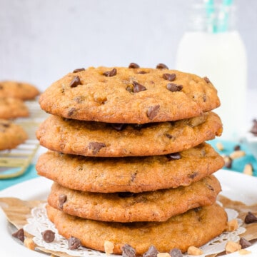 A stack of banoffee chocolate chip cookies stacked on a white plate