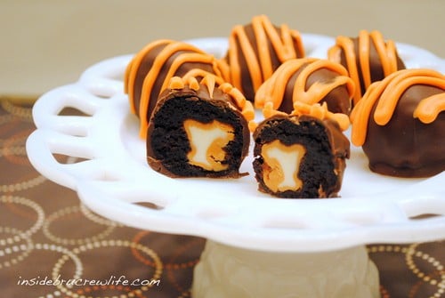 Pumpkin spice kisses wrapped in a brownie and dipped in chocolate for a fun and creative truffle.