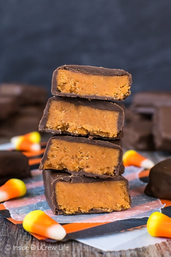 Four homemade butterfinger bars cut in half and stacked on top of each other.