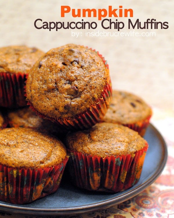 Pumpkin muffins stacked on a blue plate.