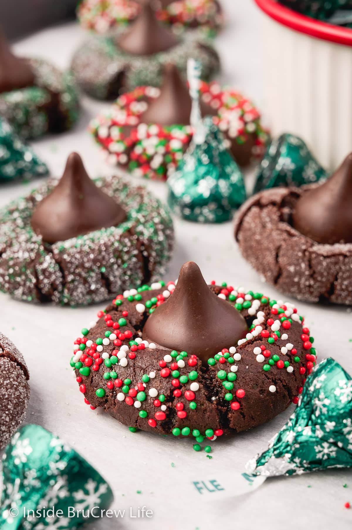 Chocolate sprinkle cookies topped with chocolate kisses.