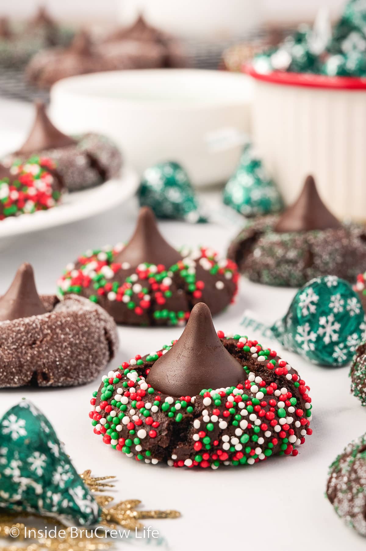 Chocolate sprinkle cookies topped with chocolate kisses.