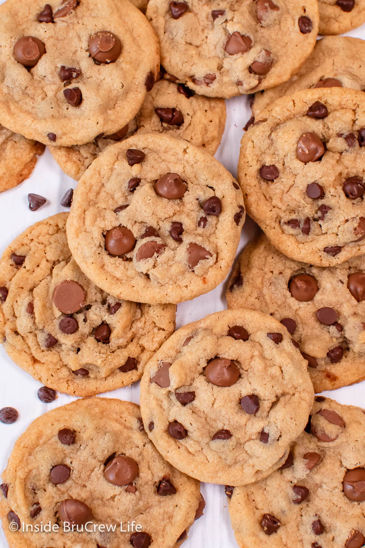 Mini chocolate chip cookies stacked on top of each other.