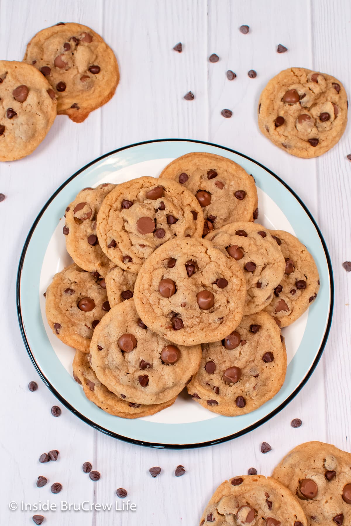 A plate on a white board with cookies on it.