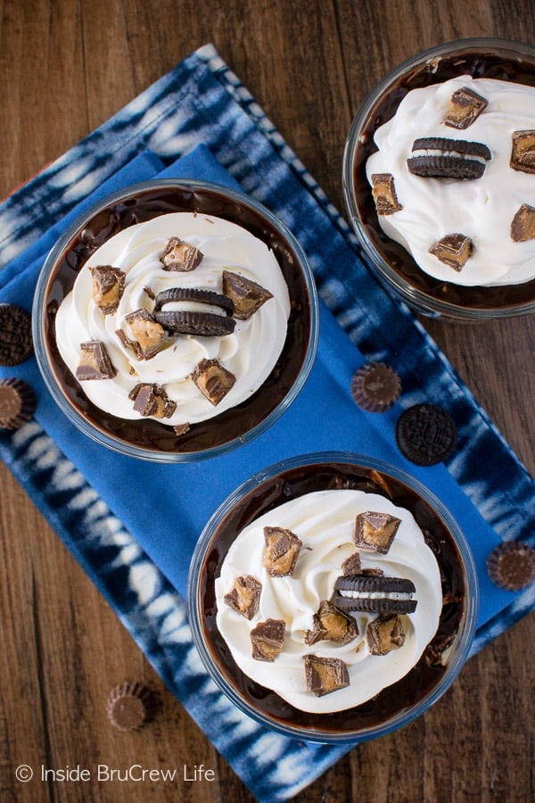 Overhead picture of pie parfaits topped with whipped cream and Oreos.