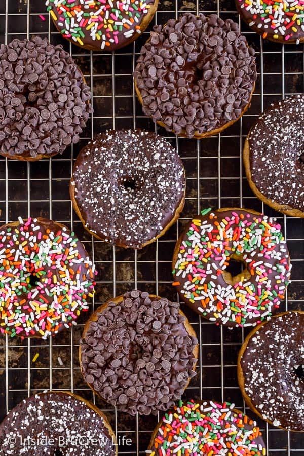 Sour Cream Banana Donuts - sprinkles and mini chocolate chips add a fun flair to these easy baked banana donuts. Great recipe to make for breakfast! #banana #donuts #chocolate #bakeddonuts