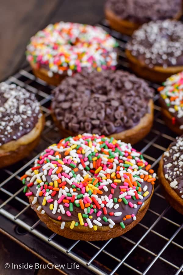 Sour Cream Banana Donuts - chocolate and sprinkles make these easy homemade donuts a fun treat for breakfast or an afternoon snack! #banana #donuts #chocolate #bakeddonuts