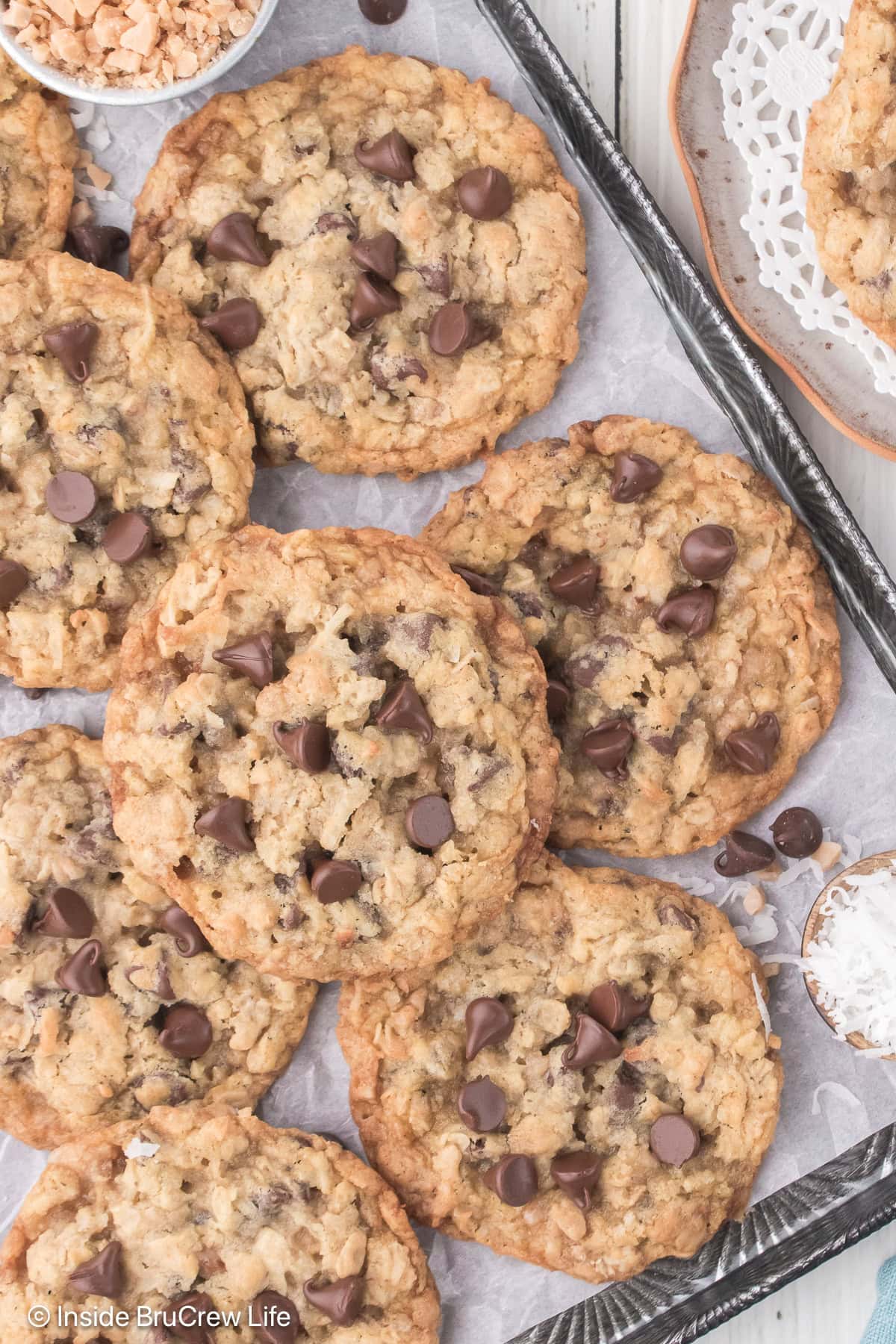 A pile of chocolate chip cookies on a pan.