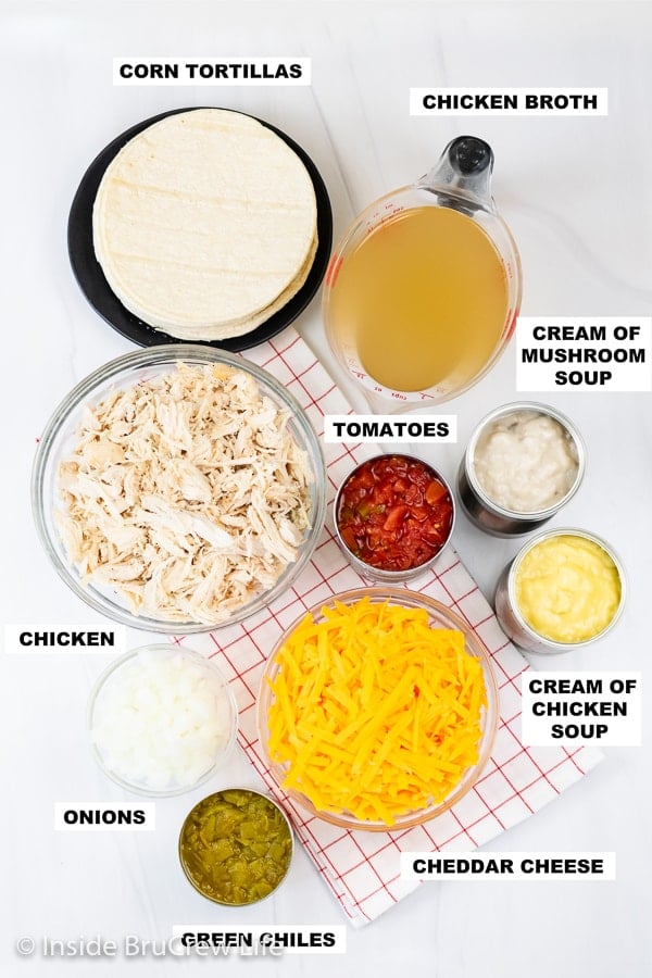 Overhead picture of a white board with bowls of ingredients to make chicken ole.