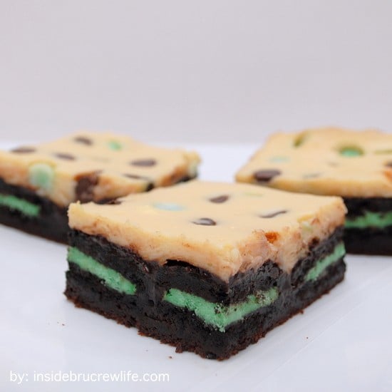 Brownies with a green mint Oreo's inside topped with chocolate chip cheesecake.