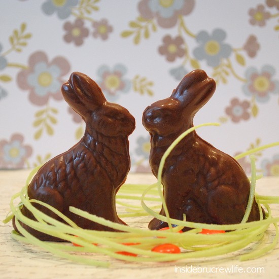 2 homemade peanut butter Easter bunnies standing in candy grass.