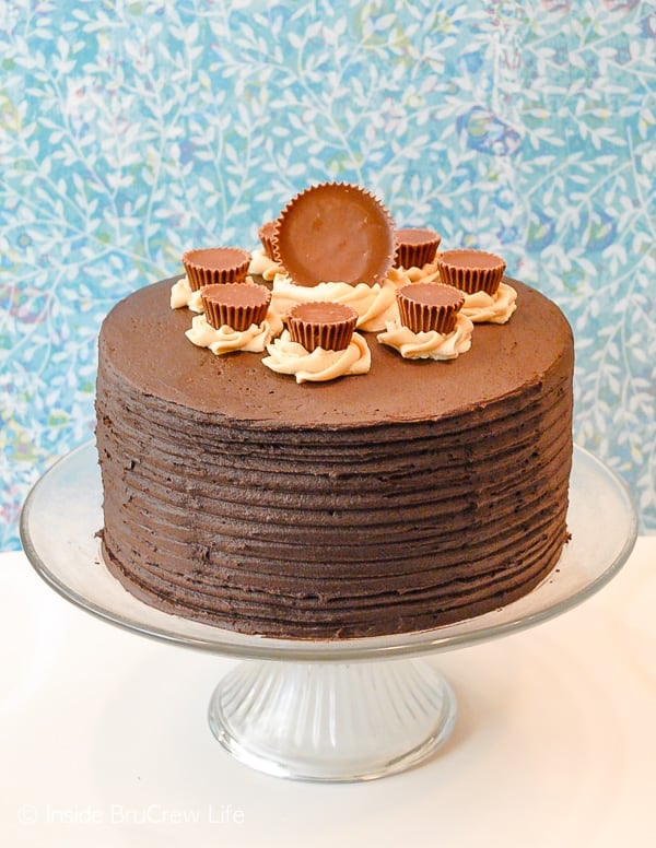 Peanut Butter Explosion Chocolate Cake -chocolate and peanut butter frosting turn this cake mix cake into a decadent dessert. Perfect recipe for parties and events! #chocolatecake #chocolate #peanutbutter #cake