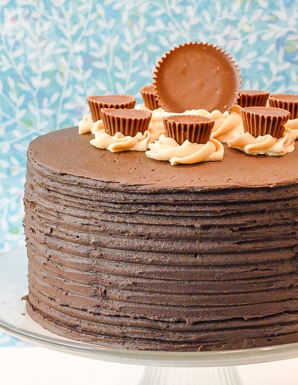 Peanut Butter Explosion Chocolate Cake - layers of chocolate and peanut butter frosting make this easy chocolate cake an impressive dessert. Make this recipe for parties or bake sales! #chocolatecake #chocolate #peanutbutter #cake