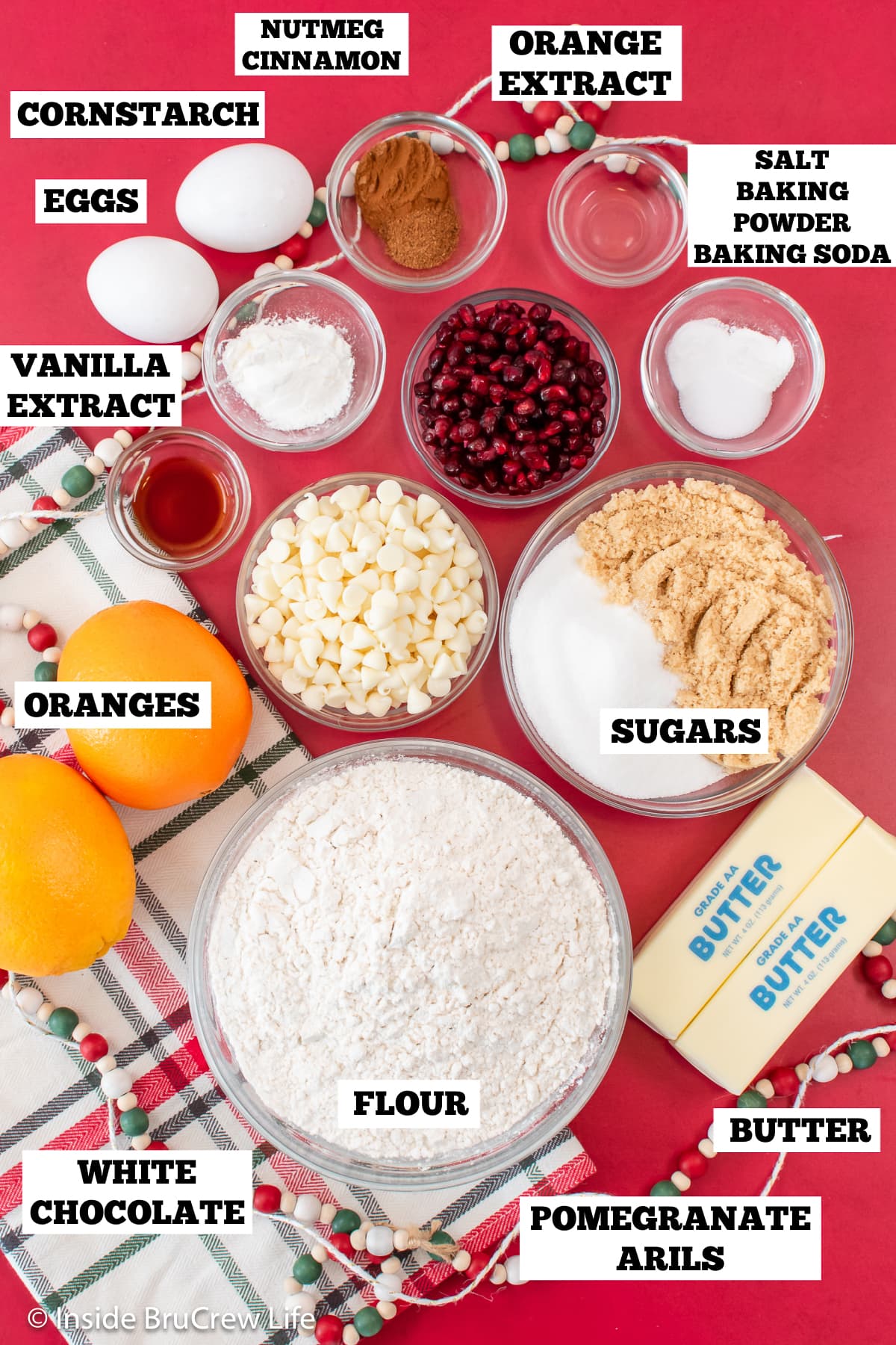 A red board with bowls of ingredients needed for cookies.
