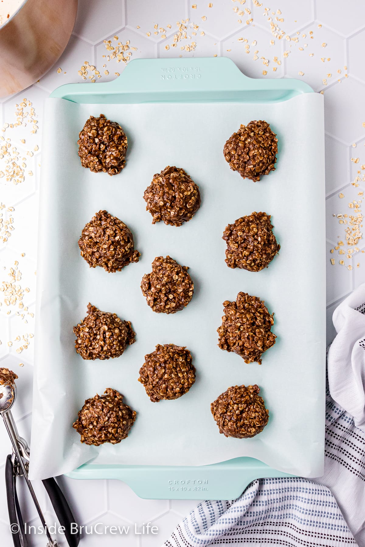 A sheet pan with drop cookies on it.