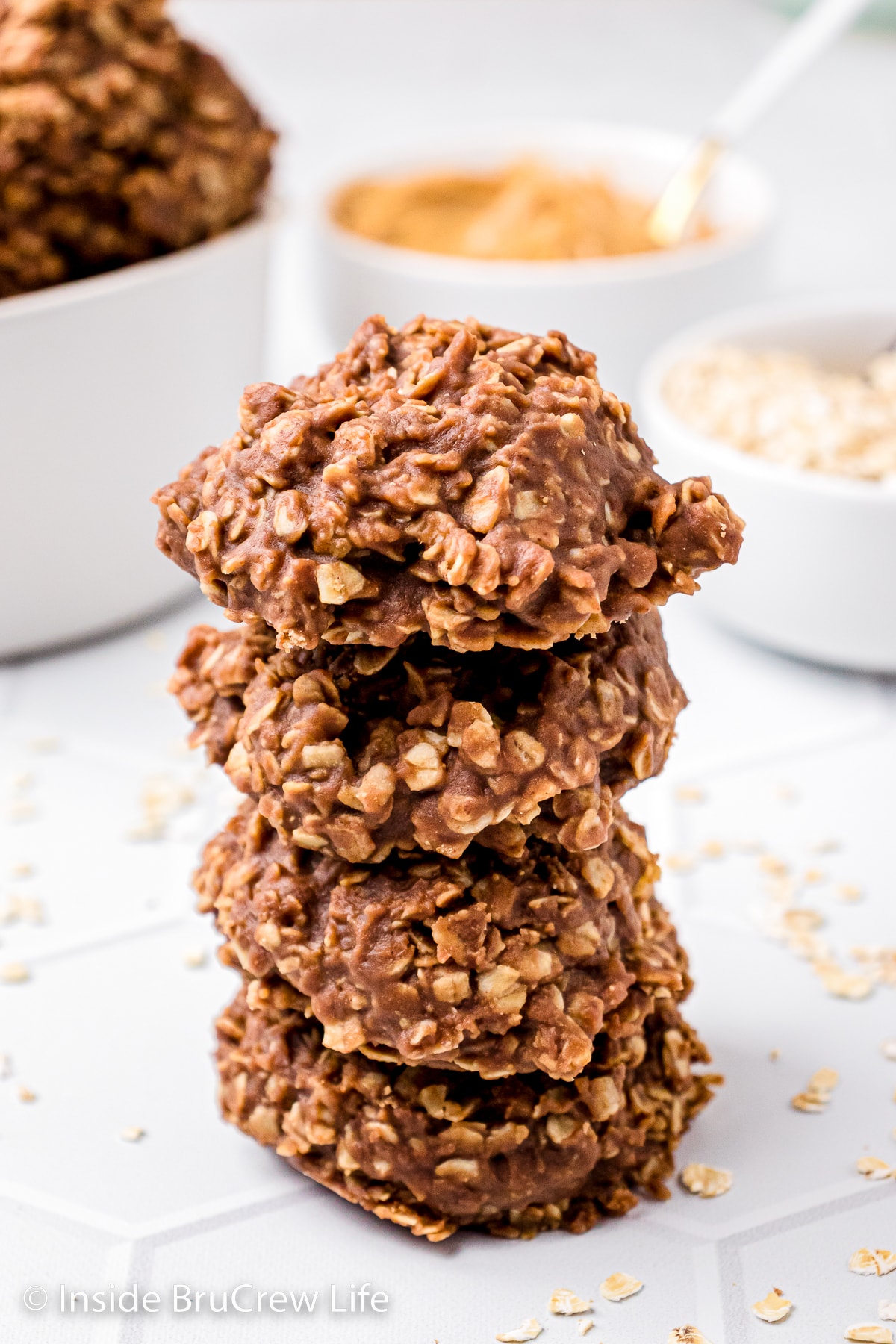A stack of four peanut butter oatmeal cookies.