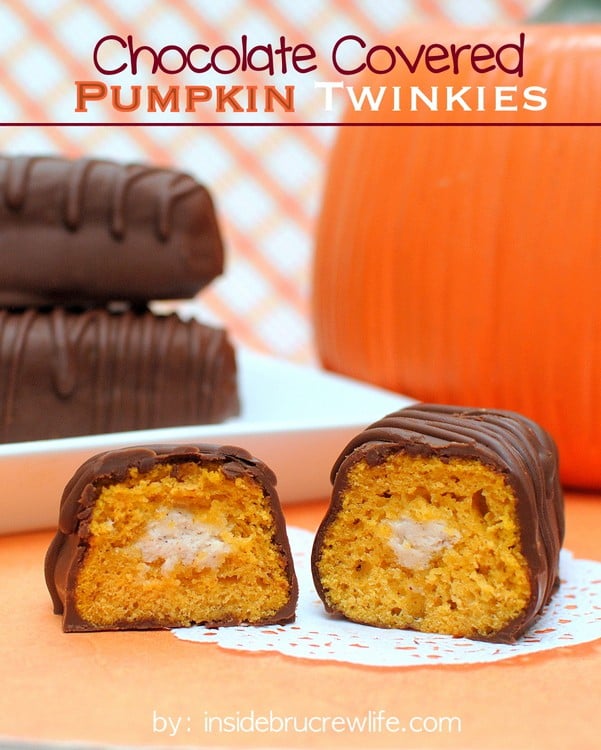 Chocolate Covered Pumpkin Twinkles -  a cinnamon buttercream filling makes these little pumpkin cakes a fun fall dessert.