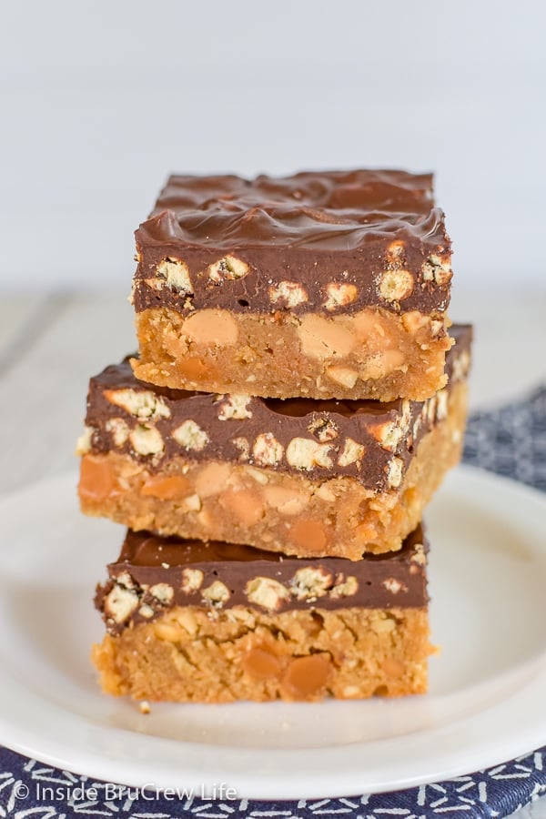 Three homemade Take 5 Bars stacked on a white plate