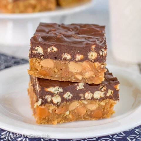 Two homemade Take 5 Bars stacked on a white plate