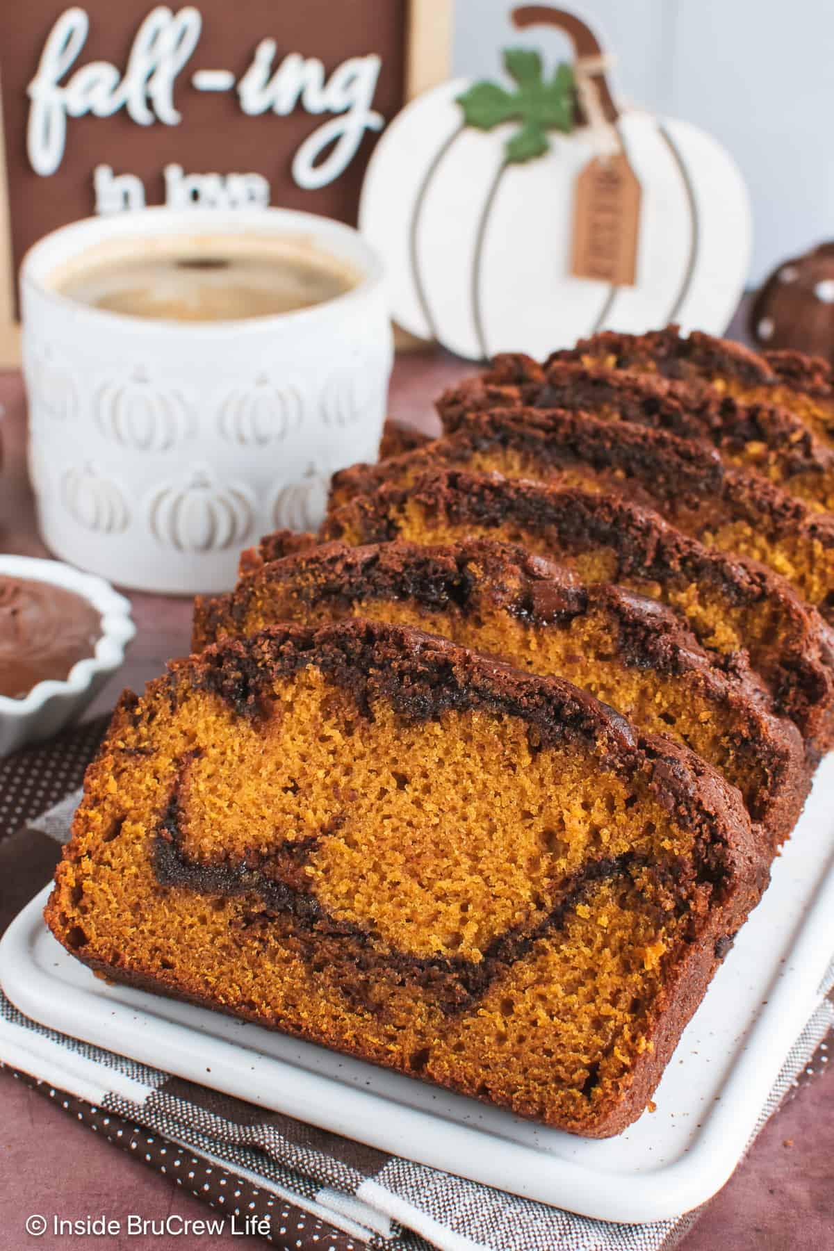 Slices of Nutella pumpkin bread on a white tray.