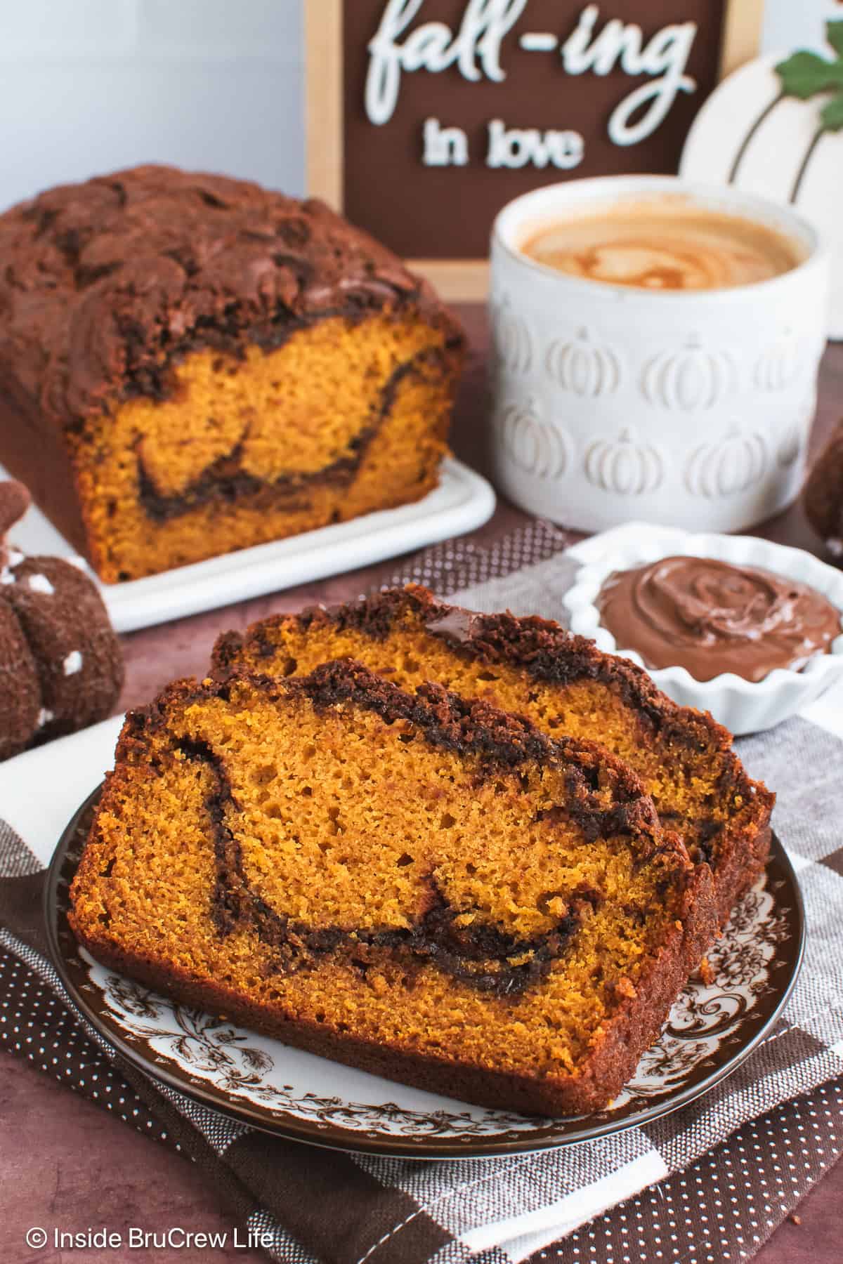 Two slices of Nutella swirled pumpkin bread on a plate.