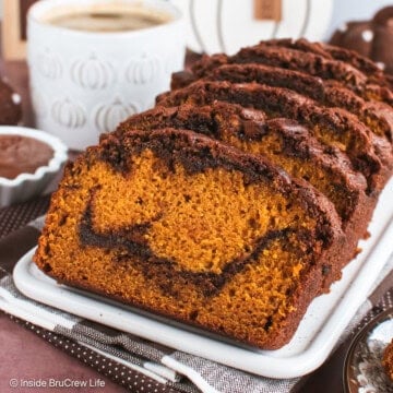 Slices of Nutella pumpkin bread on a white tray.