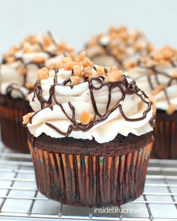 Toffee Mocha Cupcakes with chocolate drizzles and toffee bits on top
