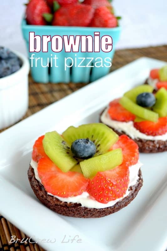 These mini brownies are topped with frosting and fresh fruit to look like flowers. So cute for parties!