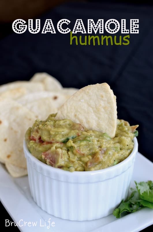 Guacamole Hummus with Football Chip- combining hummus and spicy guacamole makes a delicious appetizer. Perfect dip and chip recipe for game day parties!