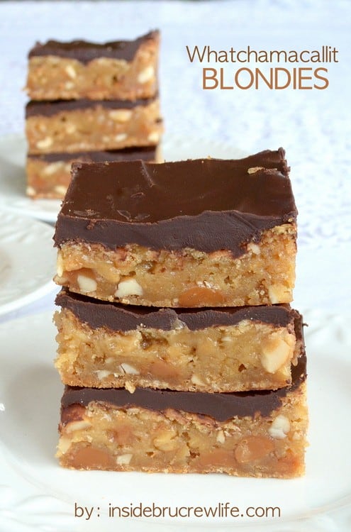 A stack of three Whatchamacallit Blondies on a white plate