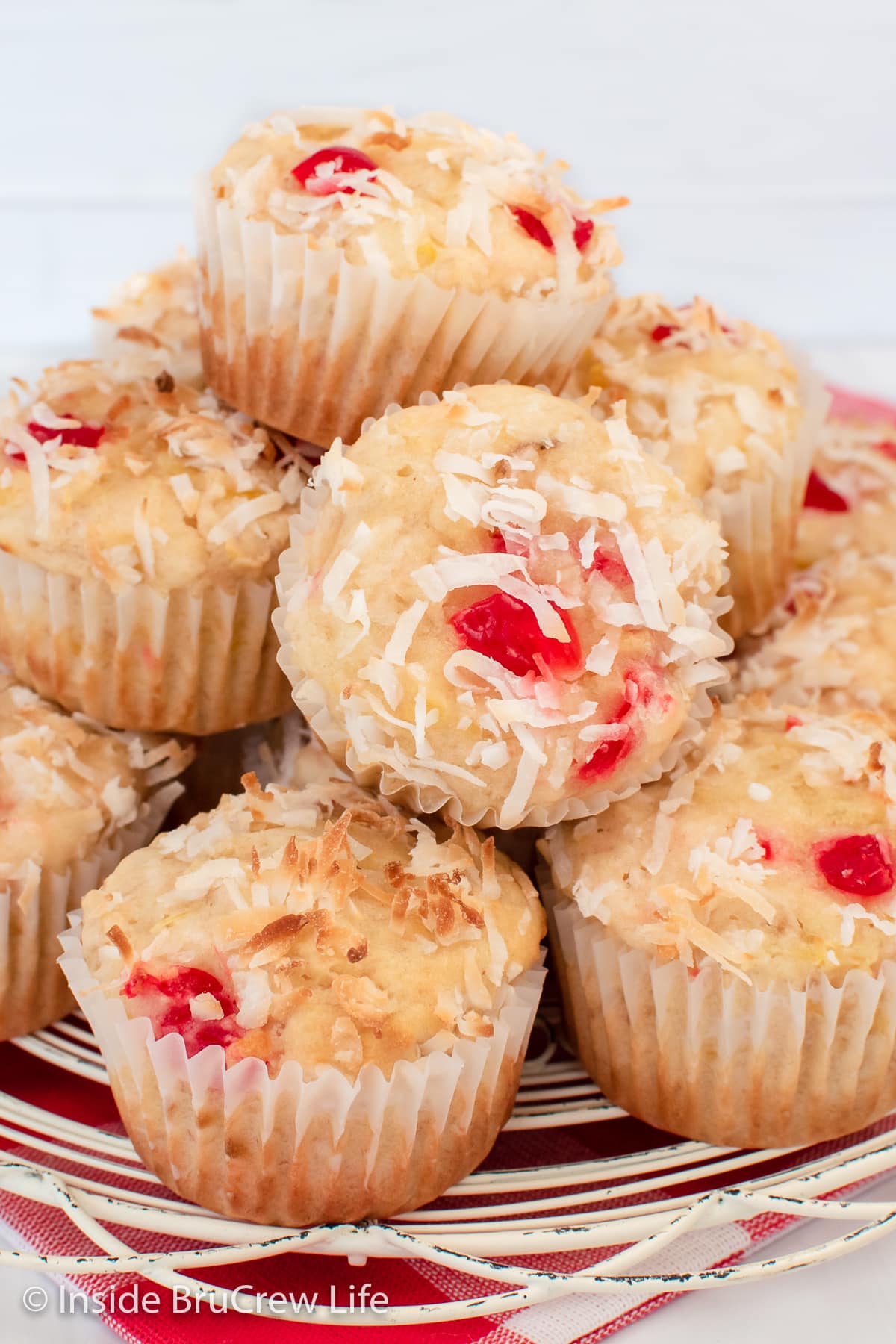 A stack of muffins on a wire tray.