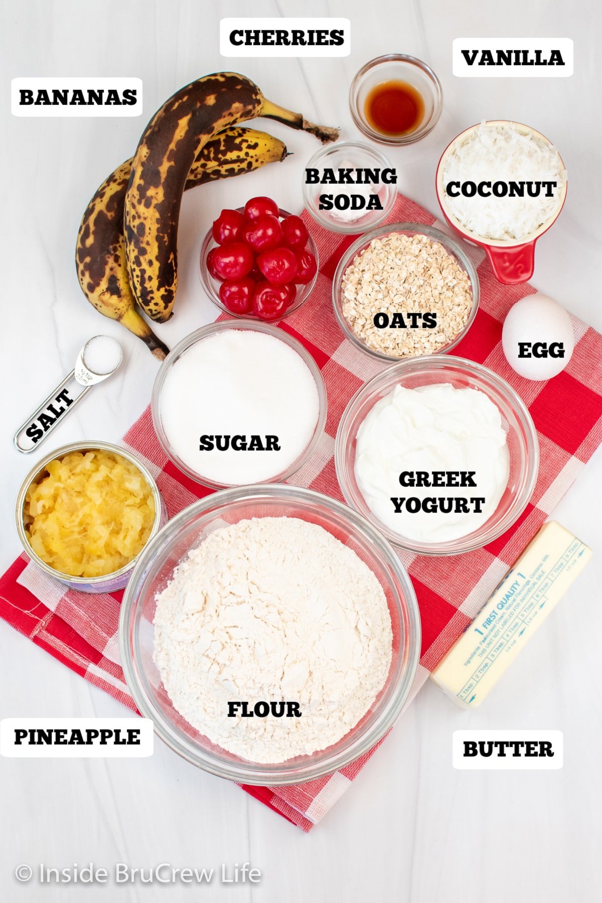 Bowls of ingredients on a white board.