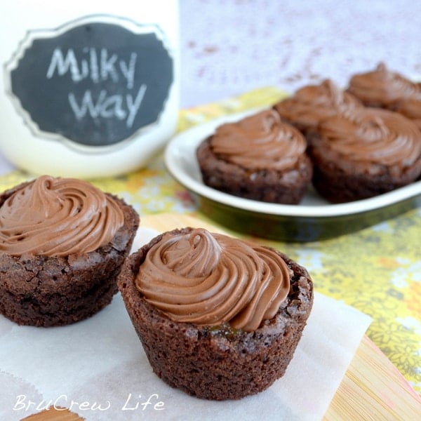 Caramel centers and whipped chocolate make these little Milky Way Brownie Cups a fun surprise treat.