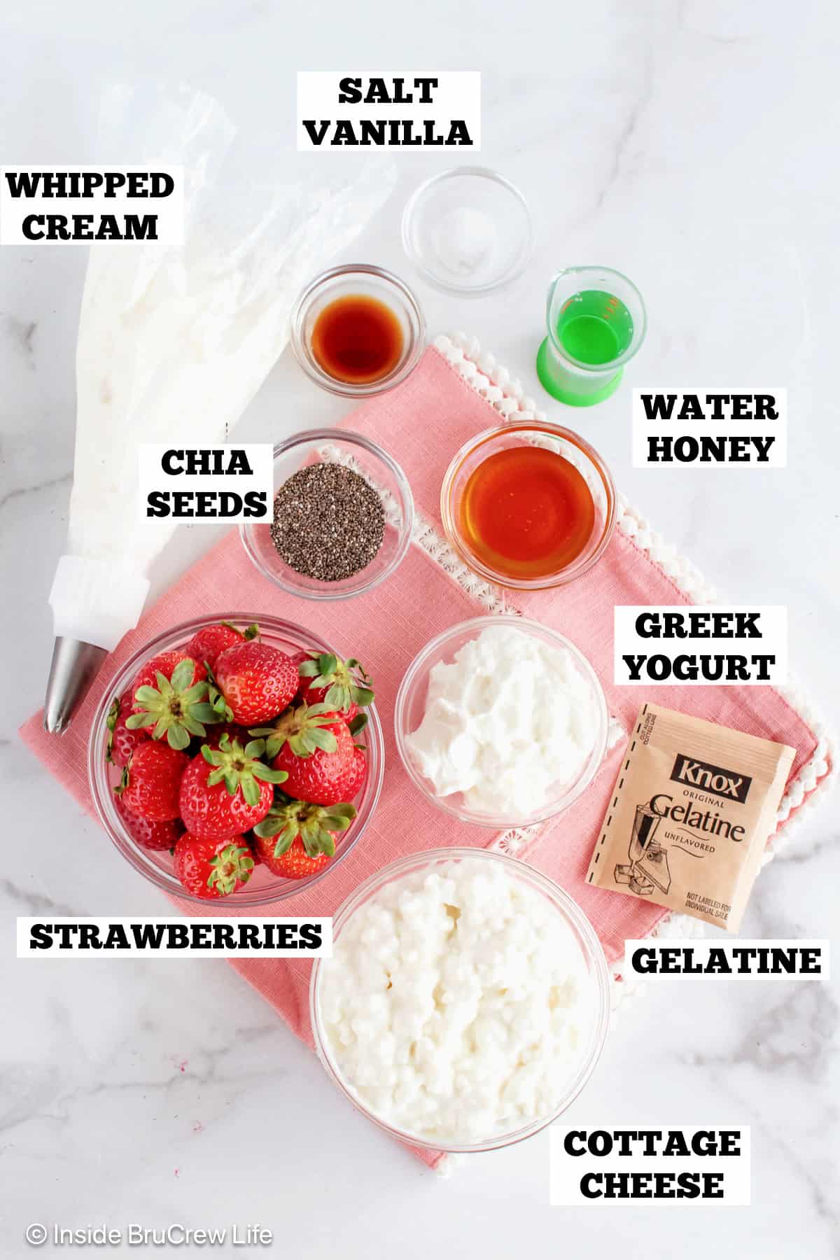 Ingredients for strawberry cheesecake cups with text labels.