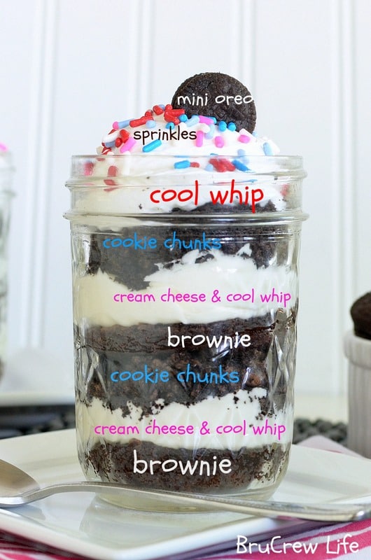 White Chocolate Oreo Brownie Parfaits - Oreo, brownies, and white chocolate cheesecake in one cute little jar https://insidebrucrewlife.com