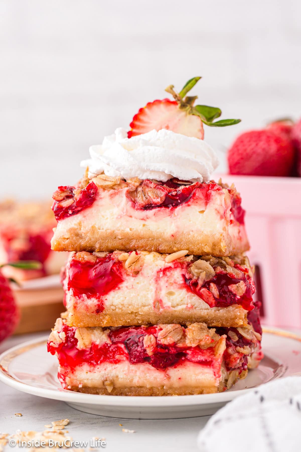 Three strawberry bars stacked on top of each other.