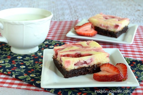 Strawberry Cheesecake Brownies - chocolate brownies topped with cheesecake and homemade strawberry pie filling swirls. Great recipe for any party or picnic!