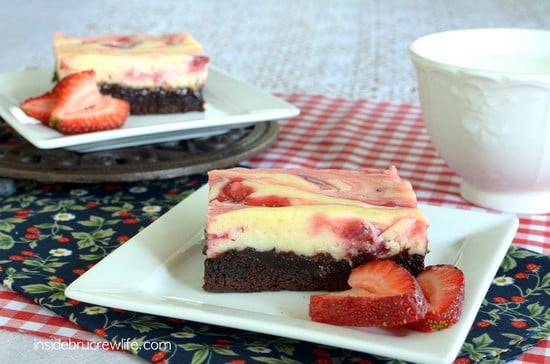 Strawberry Cheesecake Brownies - chocolate brownies topped with cheesecake and homemade strawberry pie filling swirls. Great recipe for any party or picnic!