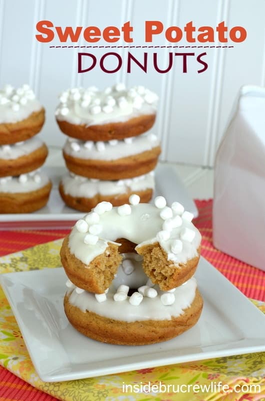 Sweet Potato Donuts - these easy baked donuts are loaded with spices and topped with white chocolate & marshmallows. Great fall breakfast recipe!